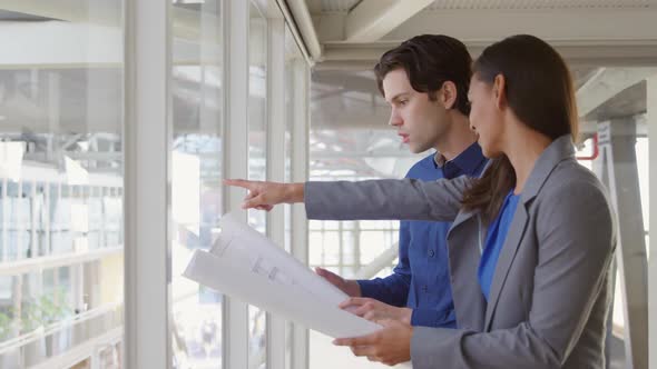 Young man and woman working in a creative office