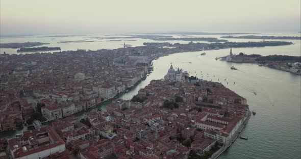Wide aerial descending shot of San Marco area from above at dusk, Venice, Italy