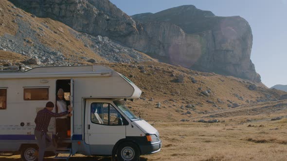 Couple Man and Woman Go Inside a Motorhome