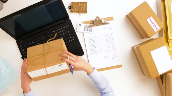 Woman with Laptop and Clipboard at Post Office 7