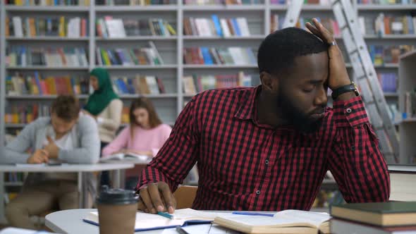 Tired Black Student Studying Difficult Assignment