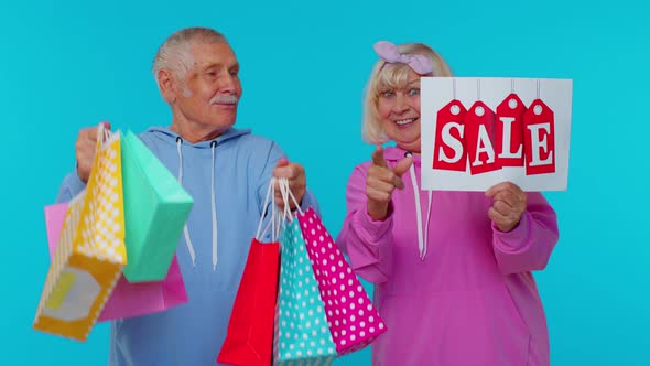 Senior Grandparents Hold Shopping Bags Sale Inscription Banner Text Advertising Price Discounts