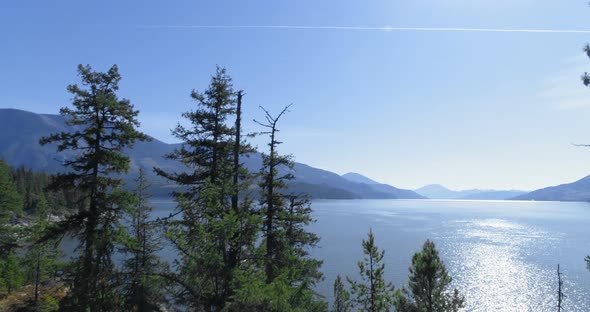 Beautiful lake surrounded by rocky mountain range 4k