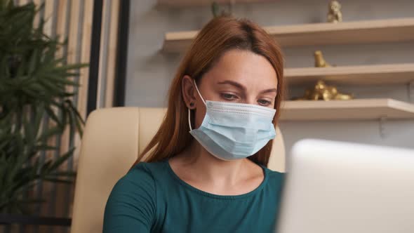 Coronavirus Quarantine. Woman at the Office with Mask for Corona Virus. 