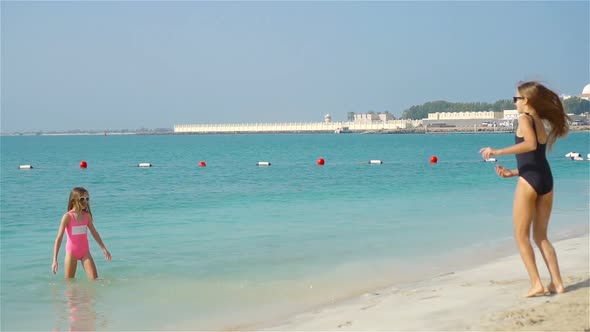 Kids Have a Lot of Fun at Tropical Beach Playing Together