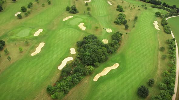 Golf course with green grass and lawns. Golf field, aerial top view