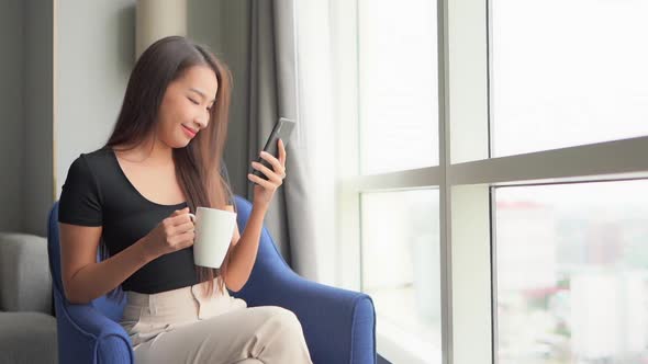 Young asian woman use smart phone