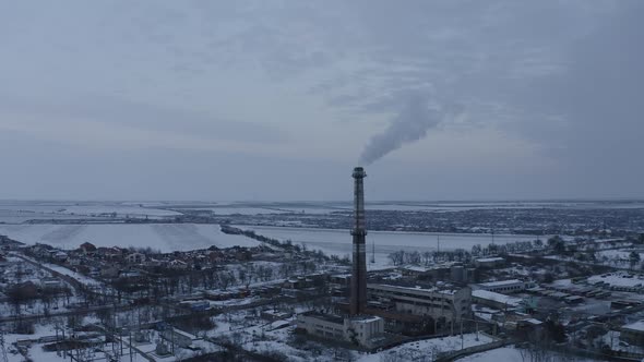 Aerial View of a Boiler Pipe of an Industrial Factory in a Cold Winter