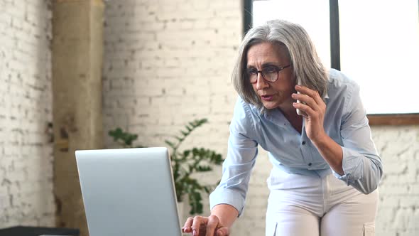 Senior Female Business Owner Talking on the Phone