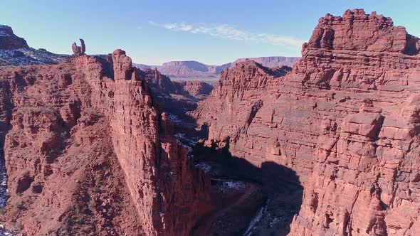 Flying over Onion Creek viewing the road and river cutting through the canyon