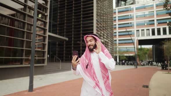 Arab Man Making Video Call on Street