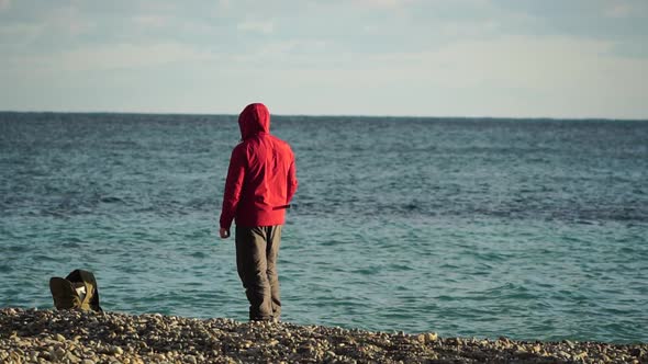 Man Hobby Fishing on Sea Tightens a Fishing Line Reel of Fish Summer