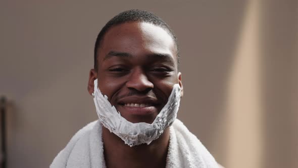 Man Shaving Happy African Guy with Foam on Face