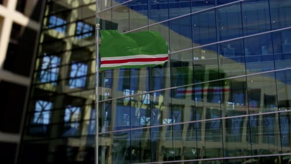 Chechen Republic of Ichkeria Flag Waving On A Skyscraper Building