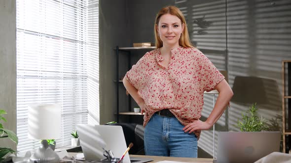 Portrait of Attractive Happy Female Creative Clothing Designer Standing in Modern Office