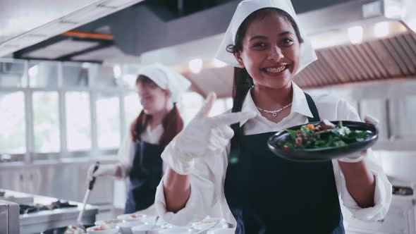 Group of schoolgirls having fun learning to cook. Female students in a cooking class.