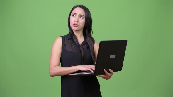 Young Beautiful Asian Businesswoman Using Laptop