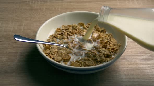 Breakfast Cereal With Milk Pouring On