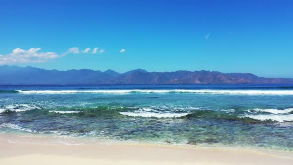 Aerial above texture of paradise lagoon beach vacation by shallow ocean with white sand background o