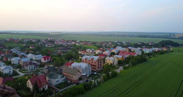 Village houses near the big city, shooting from a quadcopter