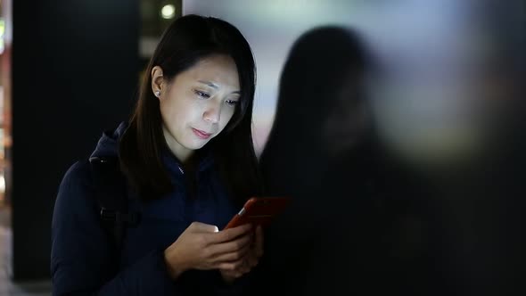 Young woman with mobile phone