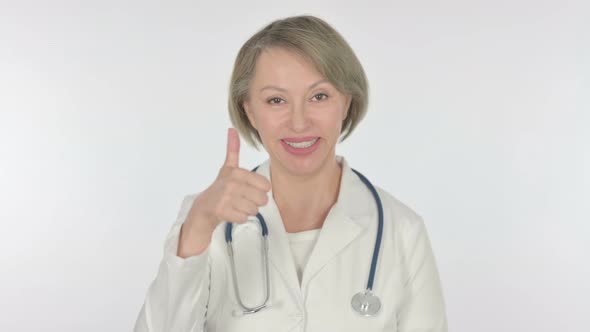 Thumbs Up By Old Female Doctor on White Background