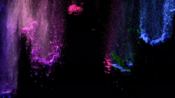 Super Slowmotion Shot of Color Powder Waterfall Isolated on Black Background