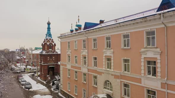 Drone Flying Over City Buildings and Roads Snow Scene in Winter in Krasnodar