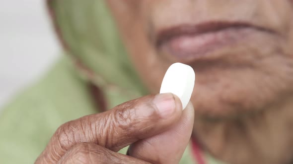 Senior Hand Holding Pills with Copy Space