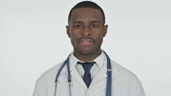 African Doctor Looking at Camera, White Background 