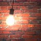 Incandescent Lamp Swinging in Dark Brickwall Room - VideoHive Item for Sale