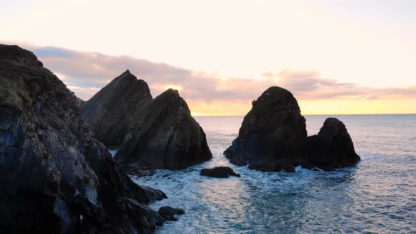 Rock Formation in Sea at Dusk 4k