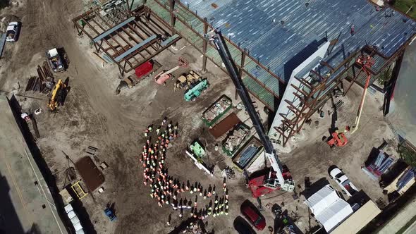 Overhead shot of a crane on a construction site.