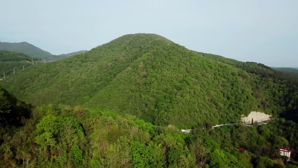 View From Above of a Curved Winding Road Trough the Mountains To Sochi, Russia