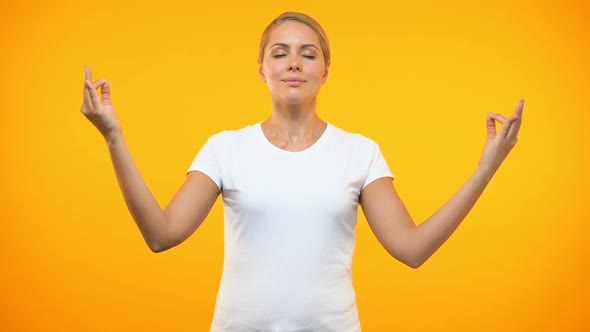 Relaxed Female Meditating on Bright Background, Yoga Techniques, Concentration