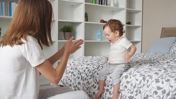 Young Happy Mother Enjoying Time with Baby