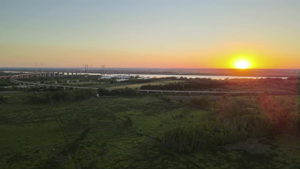 Aerial wide view of the Zarate Brazo Largo bridge crossing Parana river at sunset