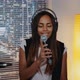 Beautiful Multiracial Girl in Headphone Singing Into Microphone and Recording a Song in Home Studio - VideoHive Item for Sale