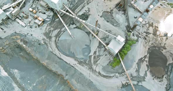 Aerial view of opencast mining quarry with lots of machinery at work in middle on Pennsylvania, US