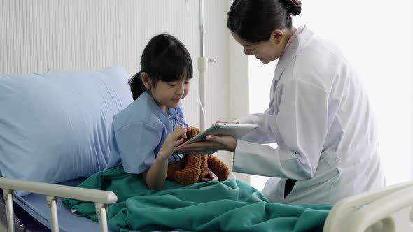 Doctor pediatrician and girl at hospital