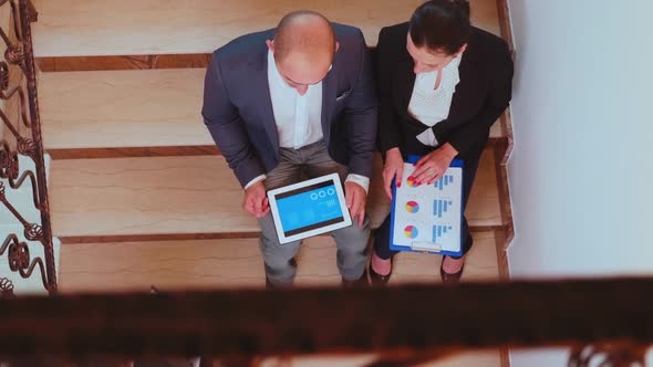 Top View of Businesswoman Talking with Corporate Manager