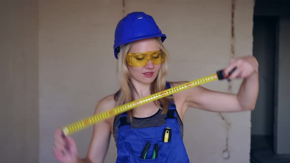 Portrait of a Young Attractive Woman Builder