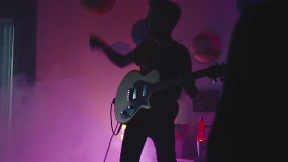 Teen Rocker Engaging Audience During Home Concert