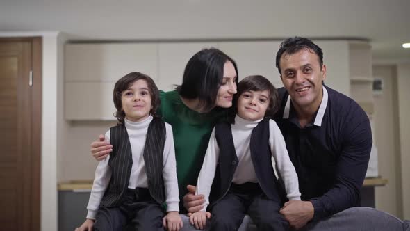 Positive Interracial Family Posing in Living Room at Home