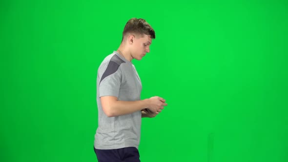 Young Man Goes Then Starts To Run, Chroma Key. Side View. Slow Motion