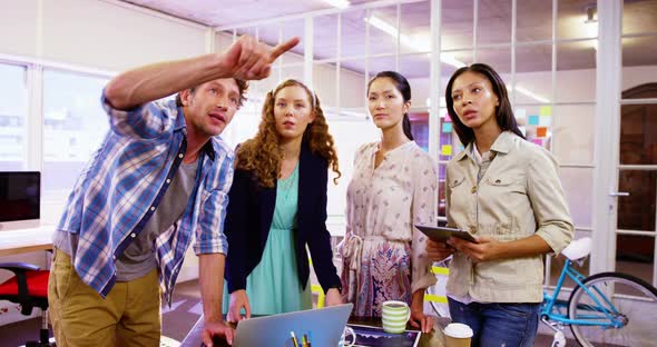 Group of business executives interacting with each other