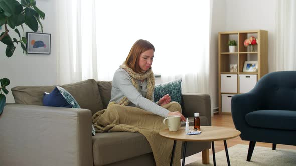 Sick Woman Measuring Temperature By Thermometer