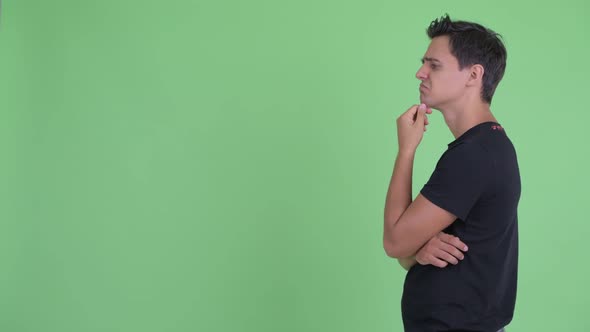 Profile View of Happy Young Handsome Man Thinking