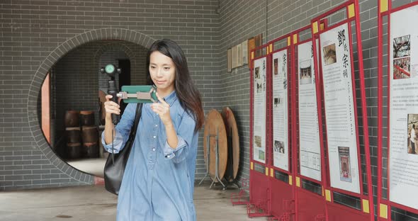 Woman taking footage Ping shan heritage trail 
