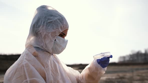 Scientist Use Water Samples From a Reservoir in Test Tubes Closeup for Scientific Research